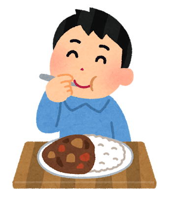 カレーを食べる少年